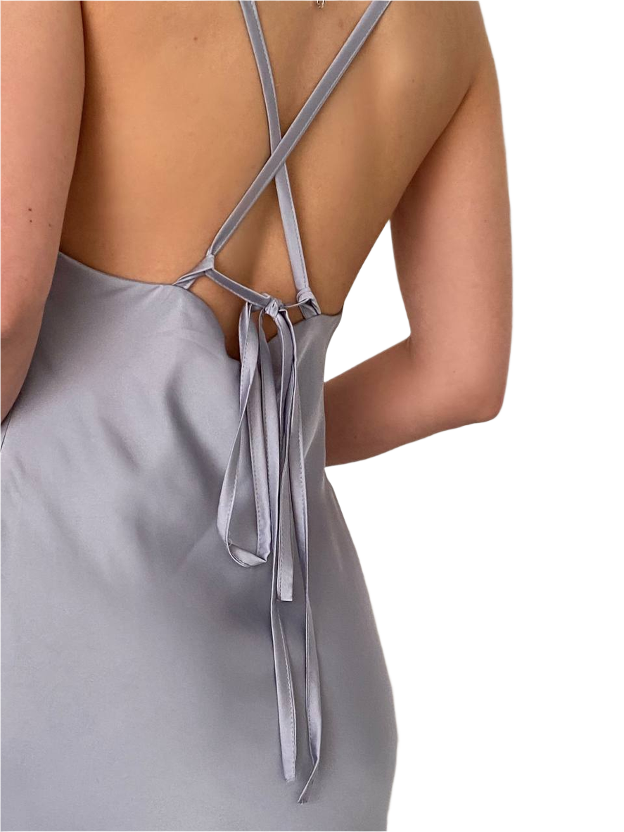 Gray dress with thin straps and a tie detail on a white background