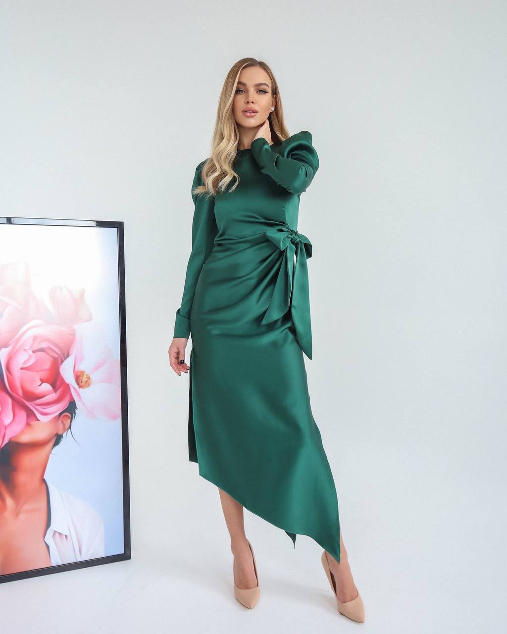 Woman wearing a green dress with a white background