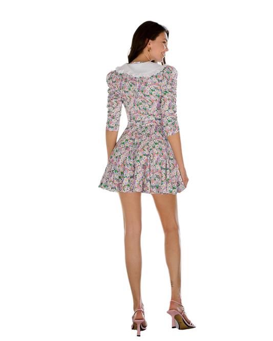 Woman wearing a floral dress on a white background