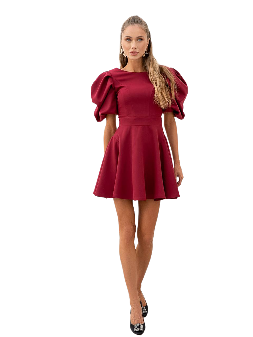 Woman wearing a red dress with puff sleeves on a white background