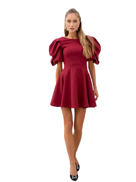 Woman wearing a red dress with puff sleeves on a white background