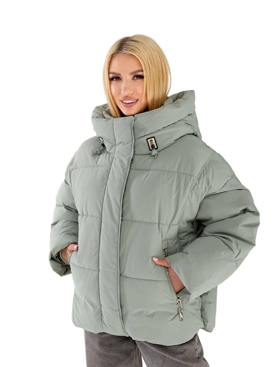 Woman wearing a light gray winter jacket on a white background