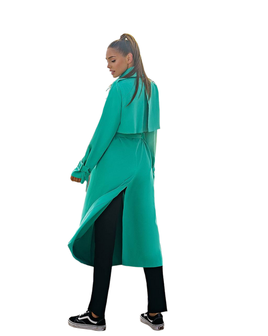 Person wearing a teal coat on a white background