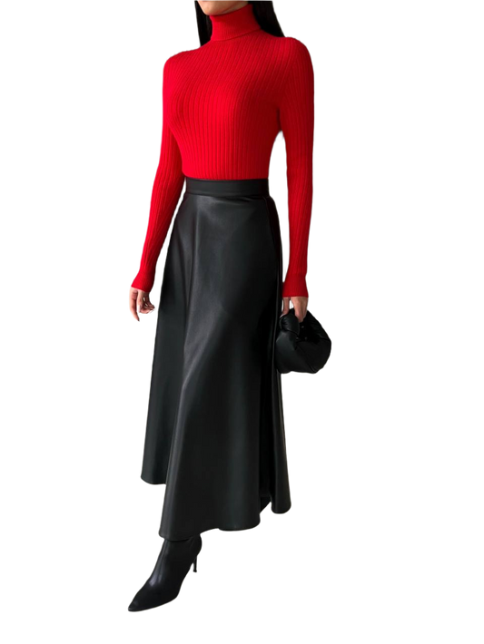 Person wearing a red turtleneck and black leather skirt on a white background