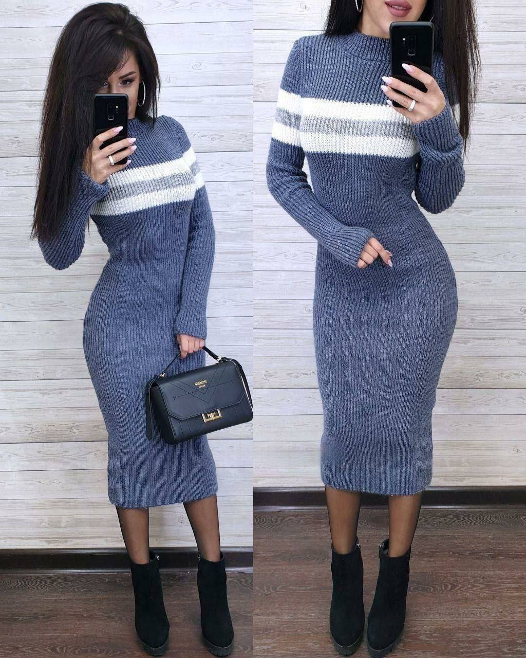 Two images of a person wearing a blue and white striped sweater dress against a light wooden panel background.