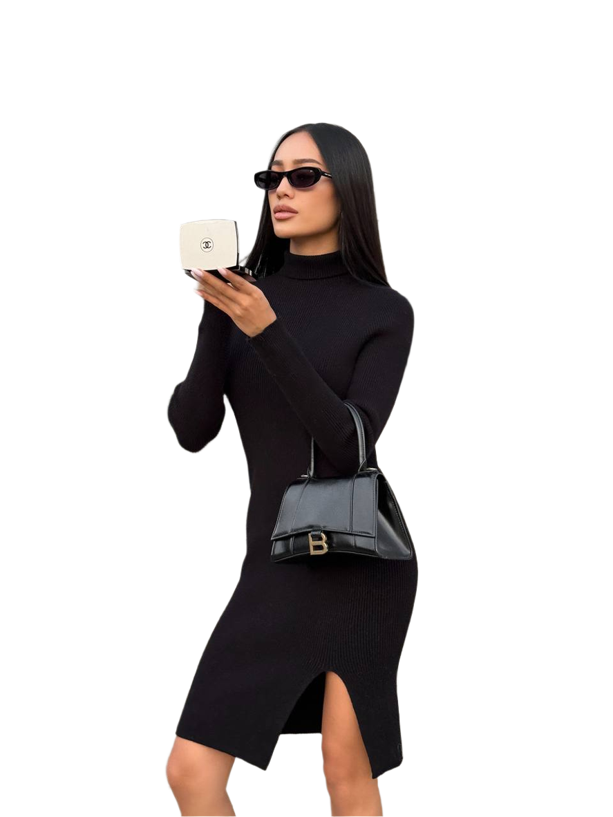 Woman in a black dress holding a black handbag and white box on a white background