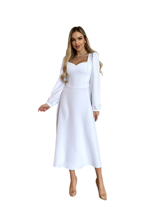 Woman wearing a white dress with long sleeves on a white background