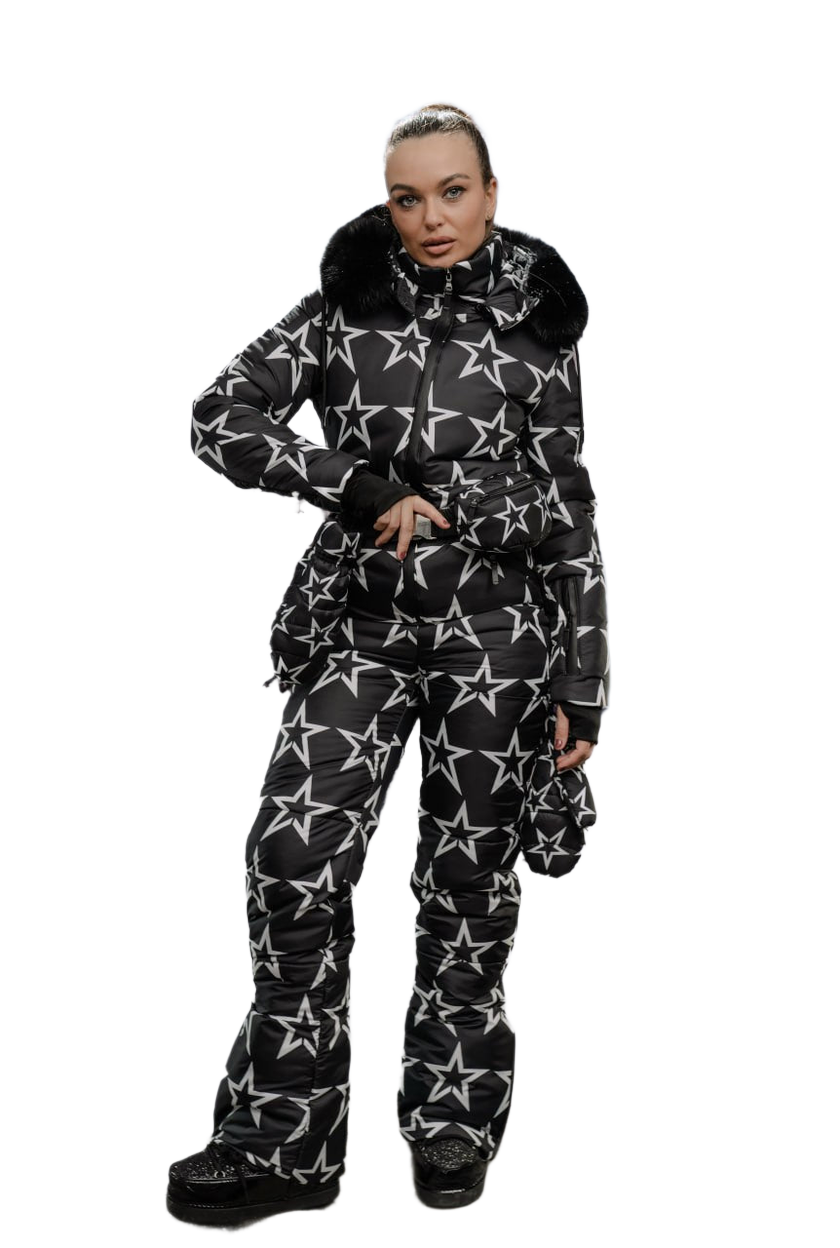 Person wearing a black snowsuit with white star pattern on a white background