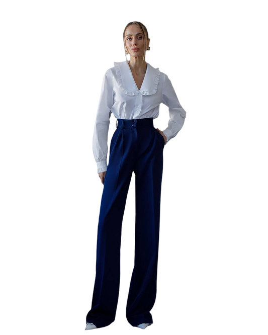 Person wearing a white blouse and navy pants on a white background