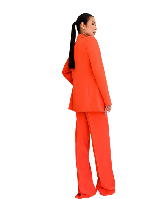 Person wearing an orange suit on a white background