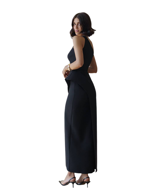 Woman wearing a black sleeveless dress on a white background