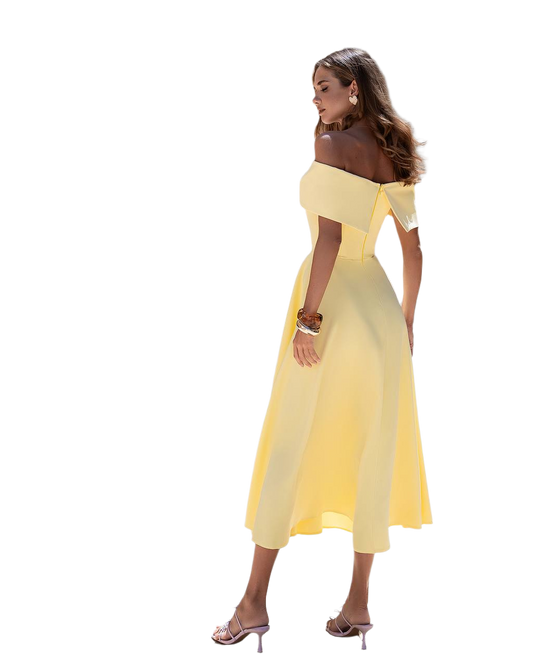 Woman wearing a yellow off-shoulder dress on a white background