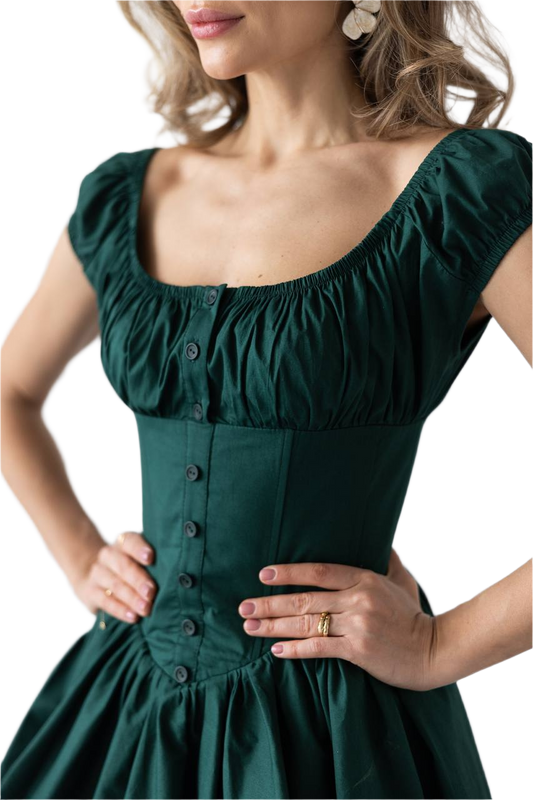Green dress with button details on a white background