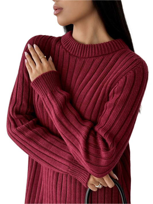Red ribbed sweater worn by a person on a white background