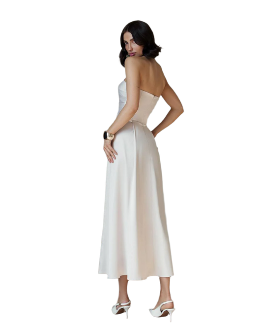 Woman wearing a white strapless dress on a white background