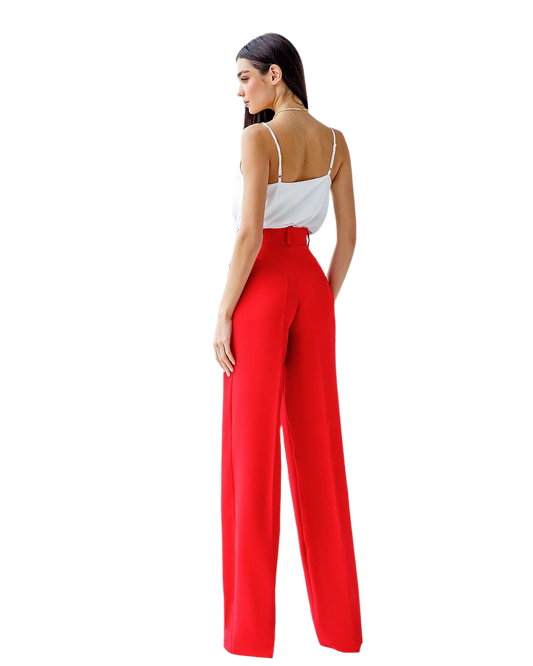 Woman wearing a white top and red pants on a white background