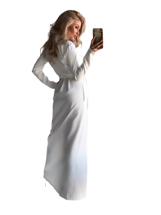Woman in a white dress taking a selfie on a white background
