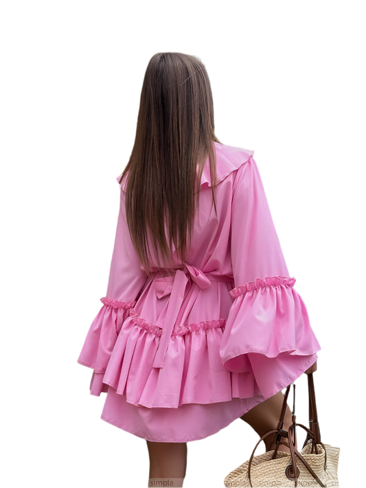 Pink dress with ruffled details on a white background