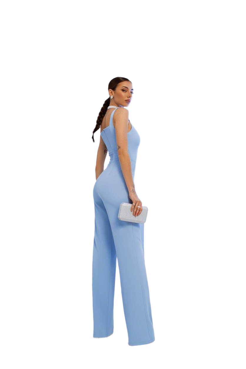 Woman wearing a light blue jumpsuit on a white background