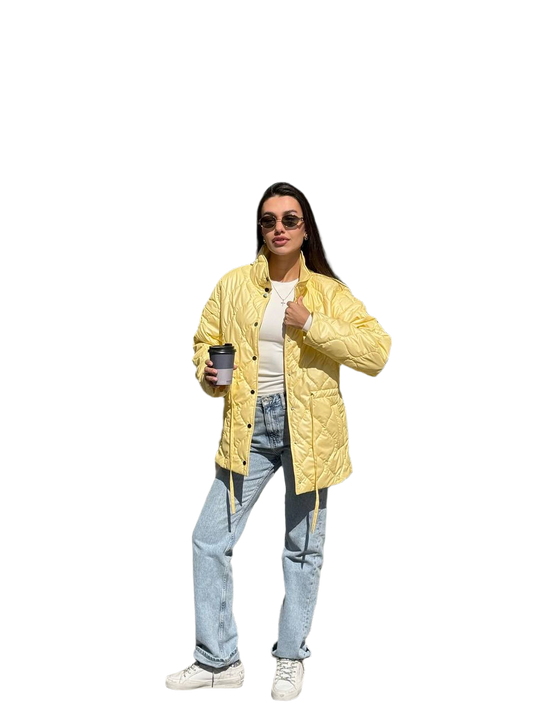 Person wearing a yellow puffer jacket holding a coffee cup on a white background