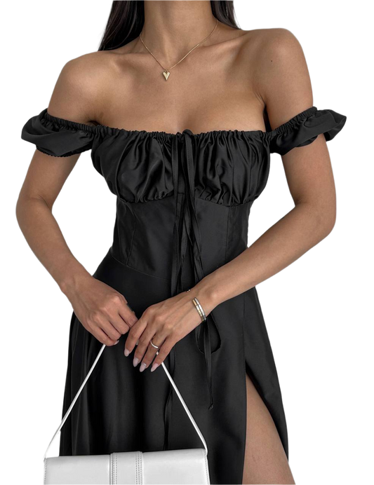 Black off-shoulder dress worn by a model on a white background