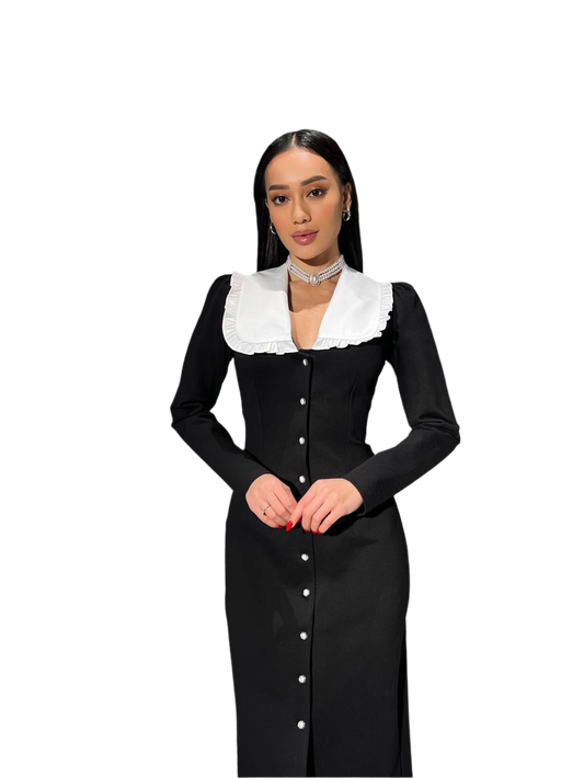 Woman wearing a black dress with a white collar on a white background