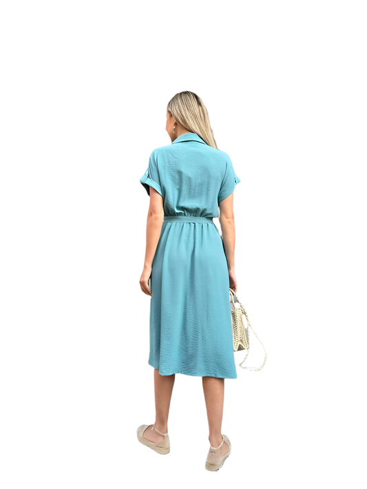 Woman wearing a light blue dress on a white background