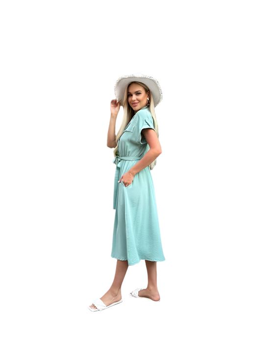 Woman wearing a light blue dress and white hat on a white background