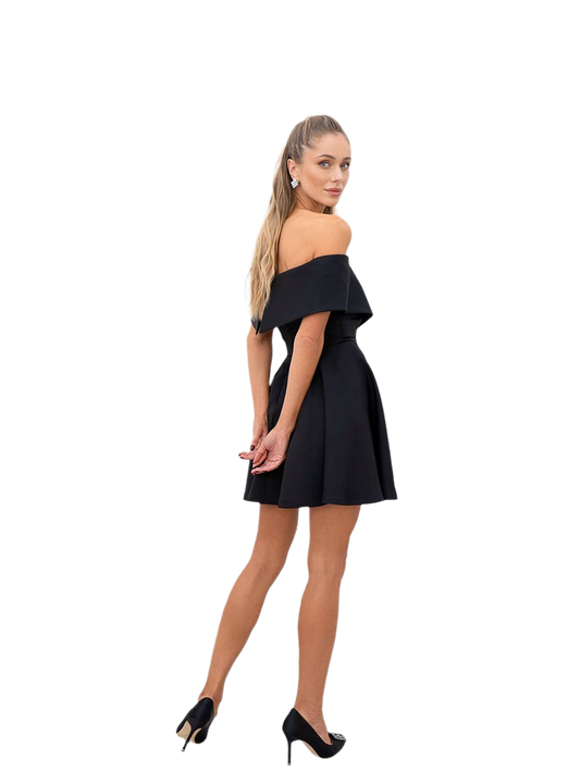Woman wearing a black off-shoulder dress on a white background
