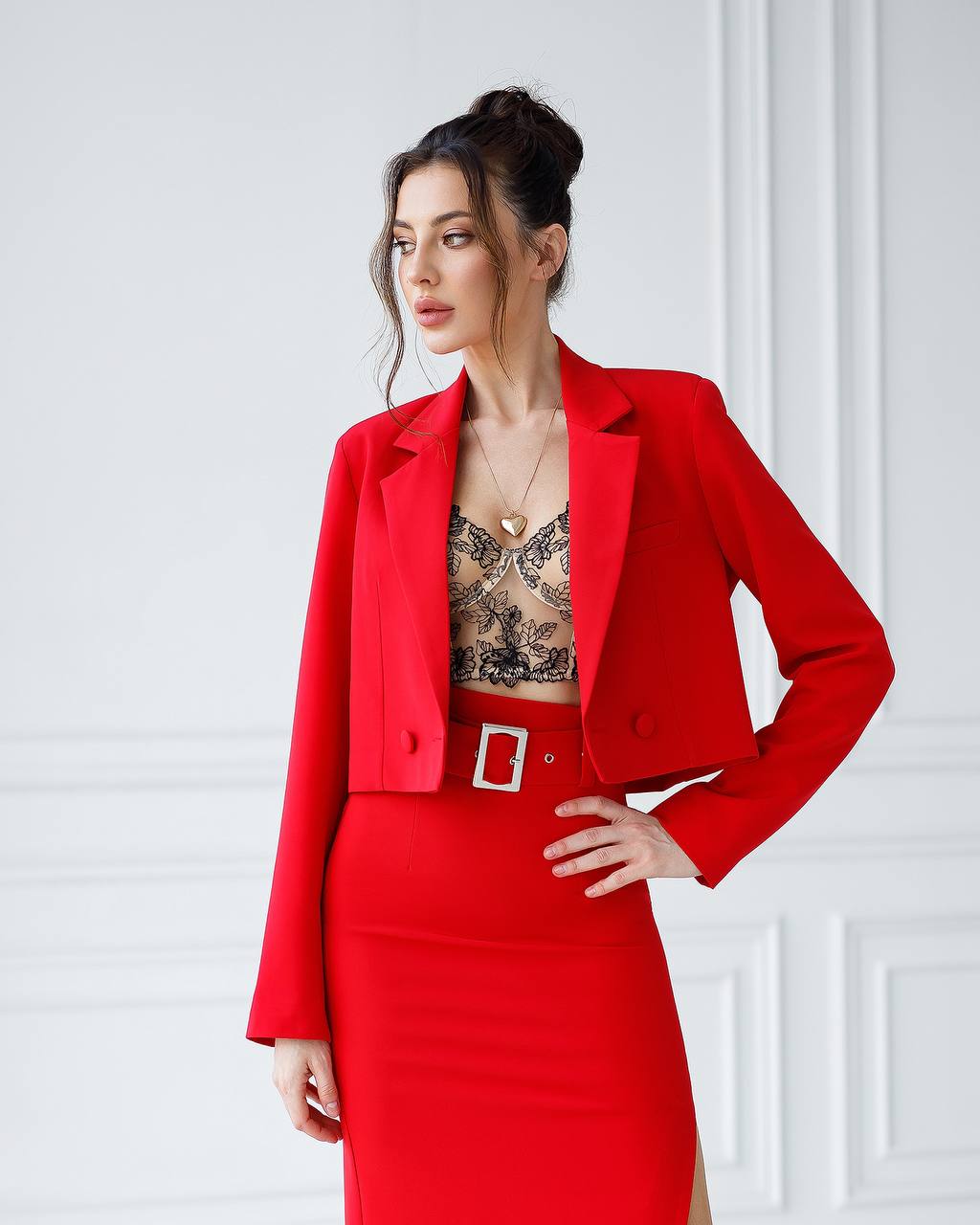 Woman wearing a red outfit with a white background