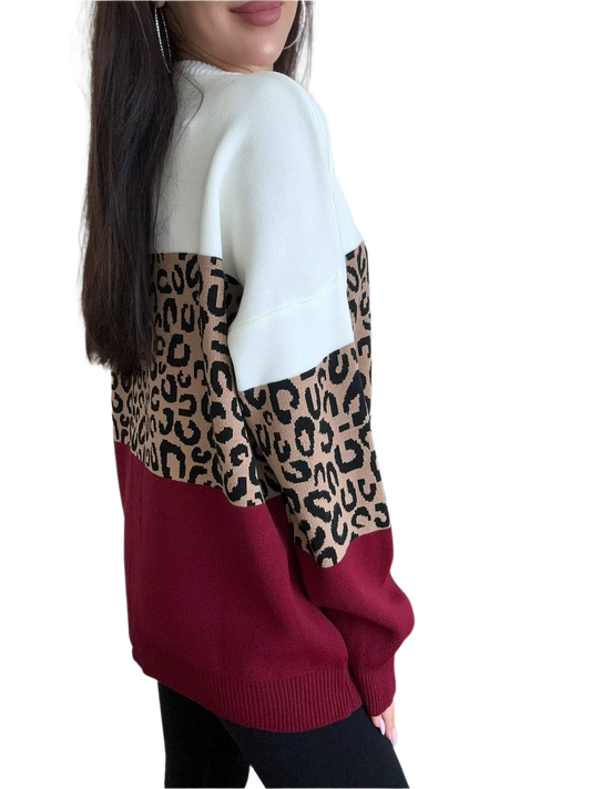 Sweater with leopard print and maroon color block on a white background