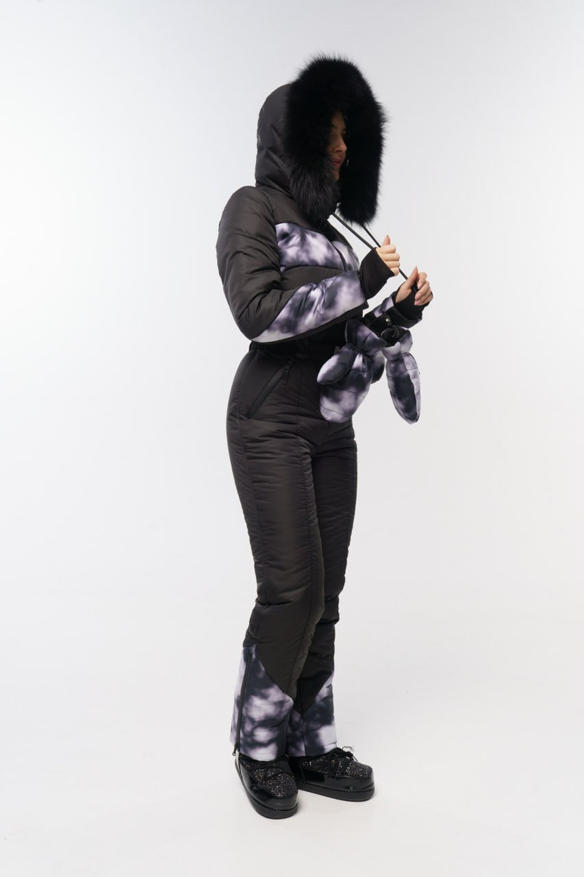 Person wearing a black and gray tie-dye hoodie and pants on a white background
