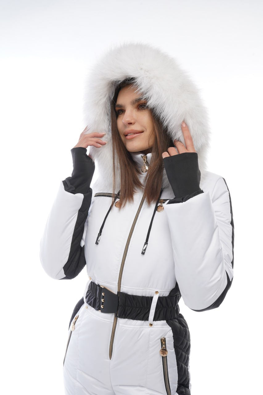 Woman wearing a white winter coat with fur hood on a white background