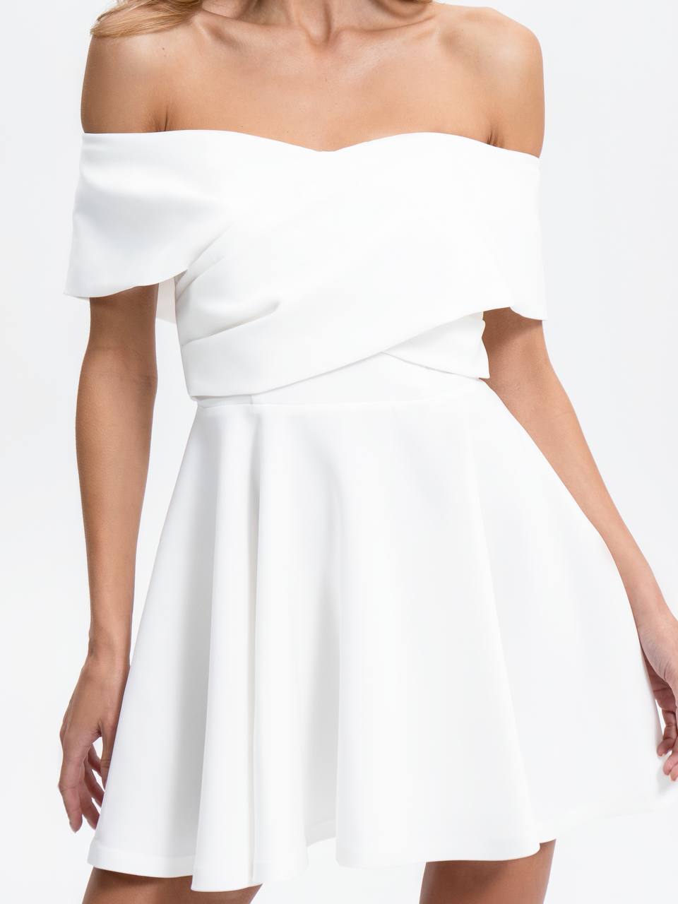 White off-shoulder dress on a white background