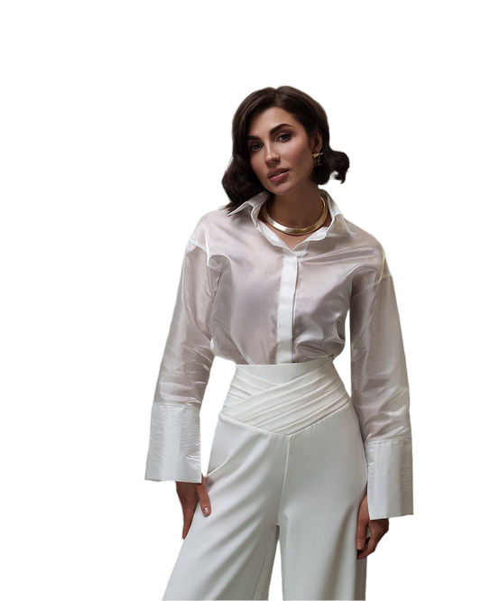 Woman wearing a white blouse and pants on a white background