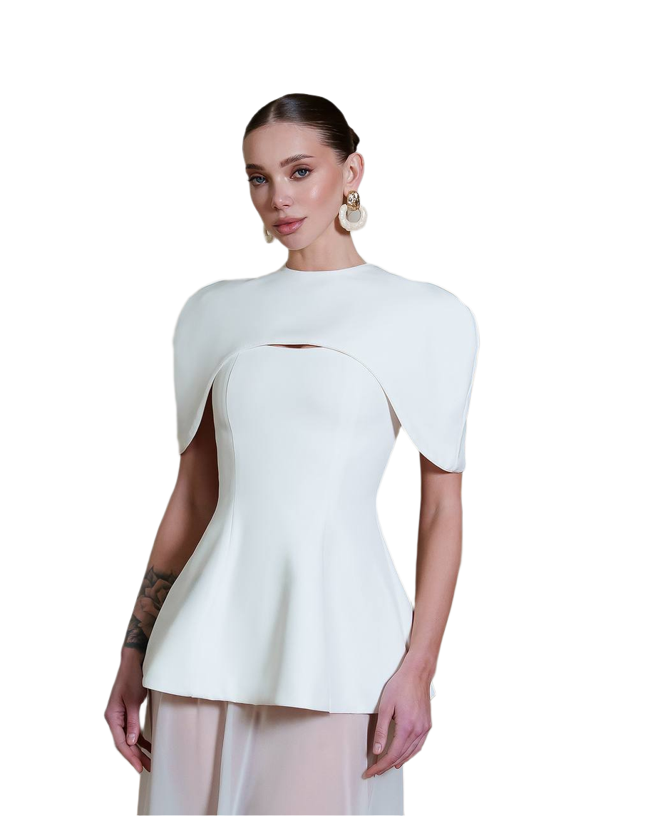 Woman wearing a white peplum top on a white background