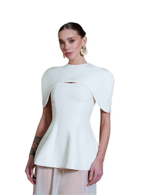 Woman wearing a white peplum top on a white background