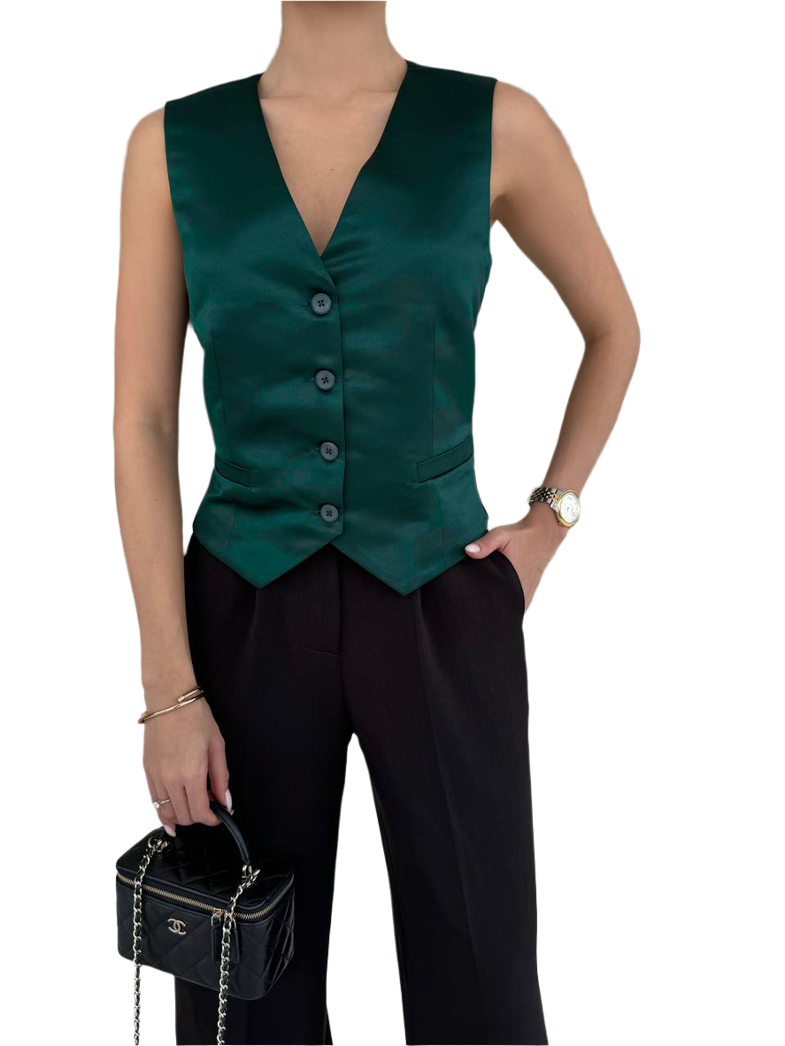 Green vest worn by a person on a white background