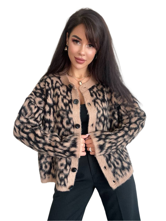 Woman wearing a leopard print cardigan on a white background