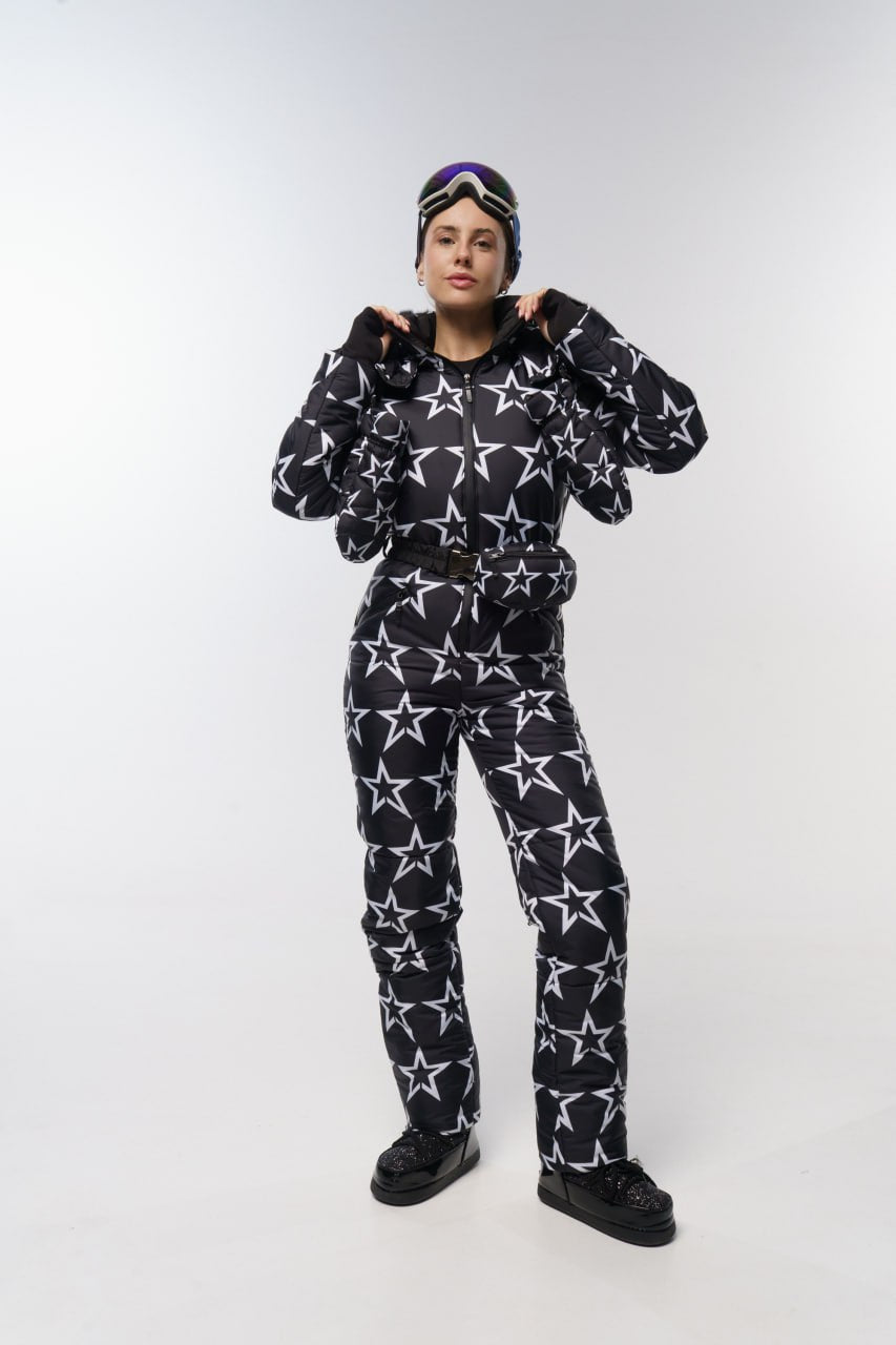 Person wearing a black star-patterned outfit on a white background