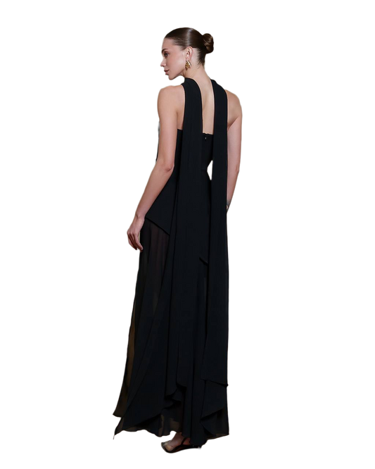 Black evening gown with a sheer overlay on a white background