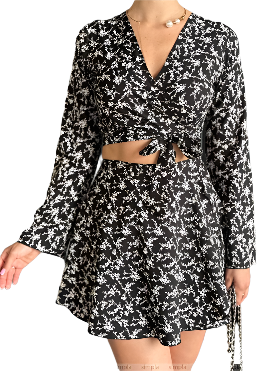 Black and white floral dress with long sleeves on a white background