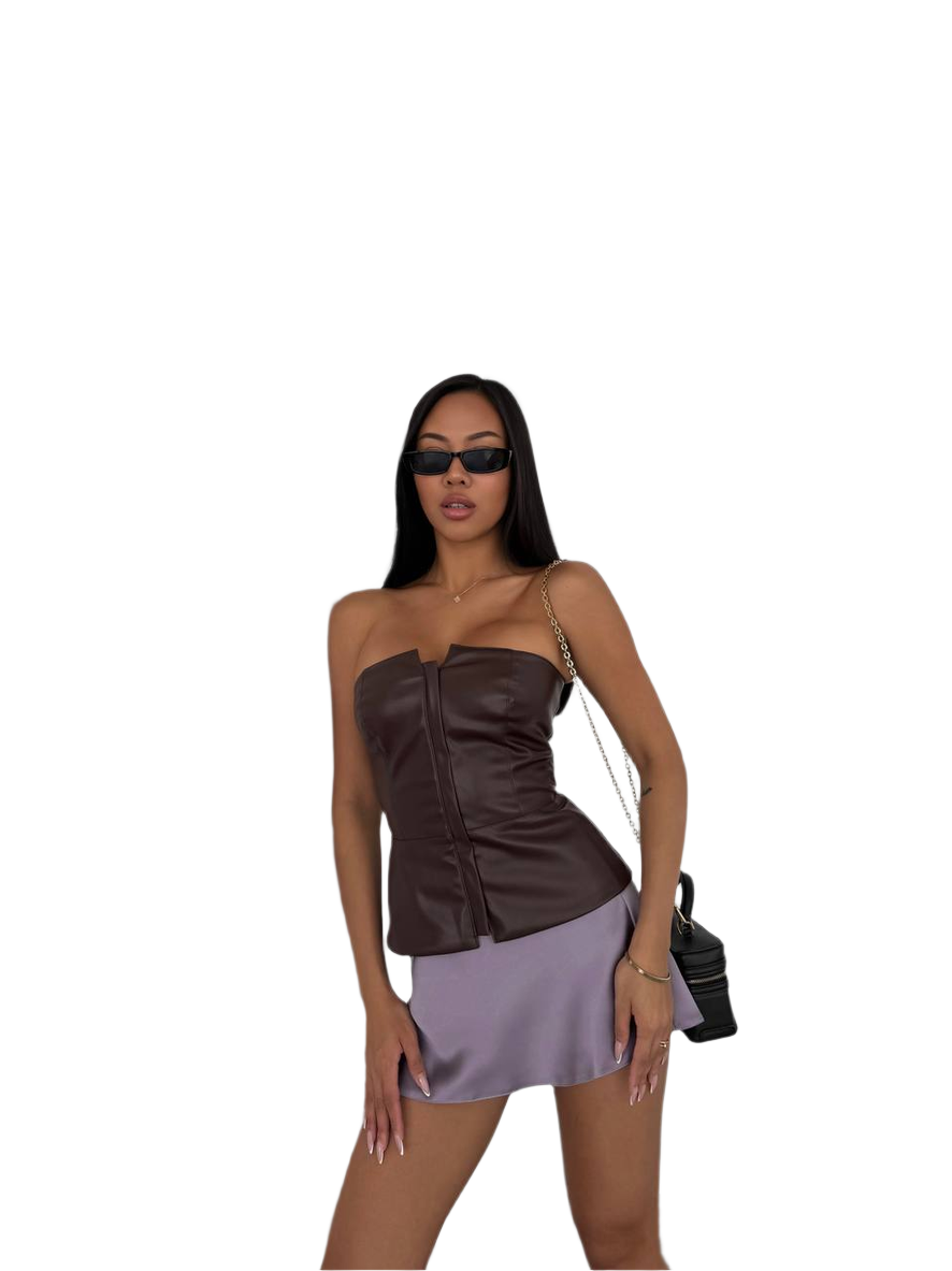 Woman wearing a brown top and purple skirt with sunglasses on a white background