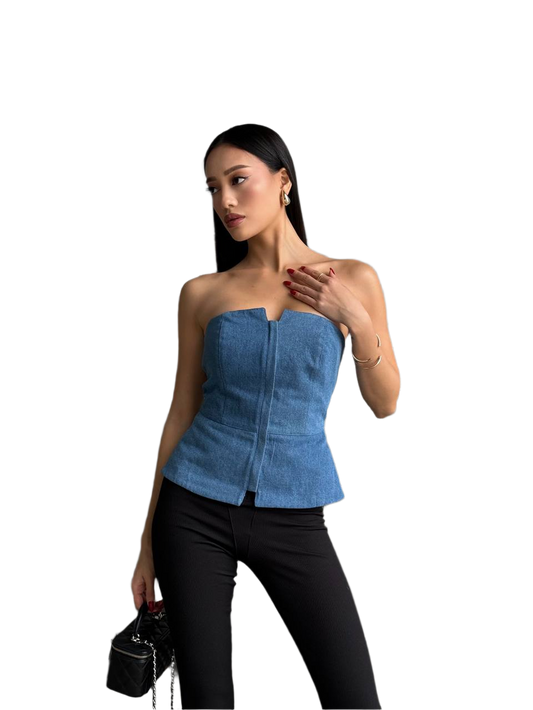 Woman wearing a blue strapless top and black pants on a white background