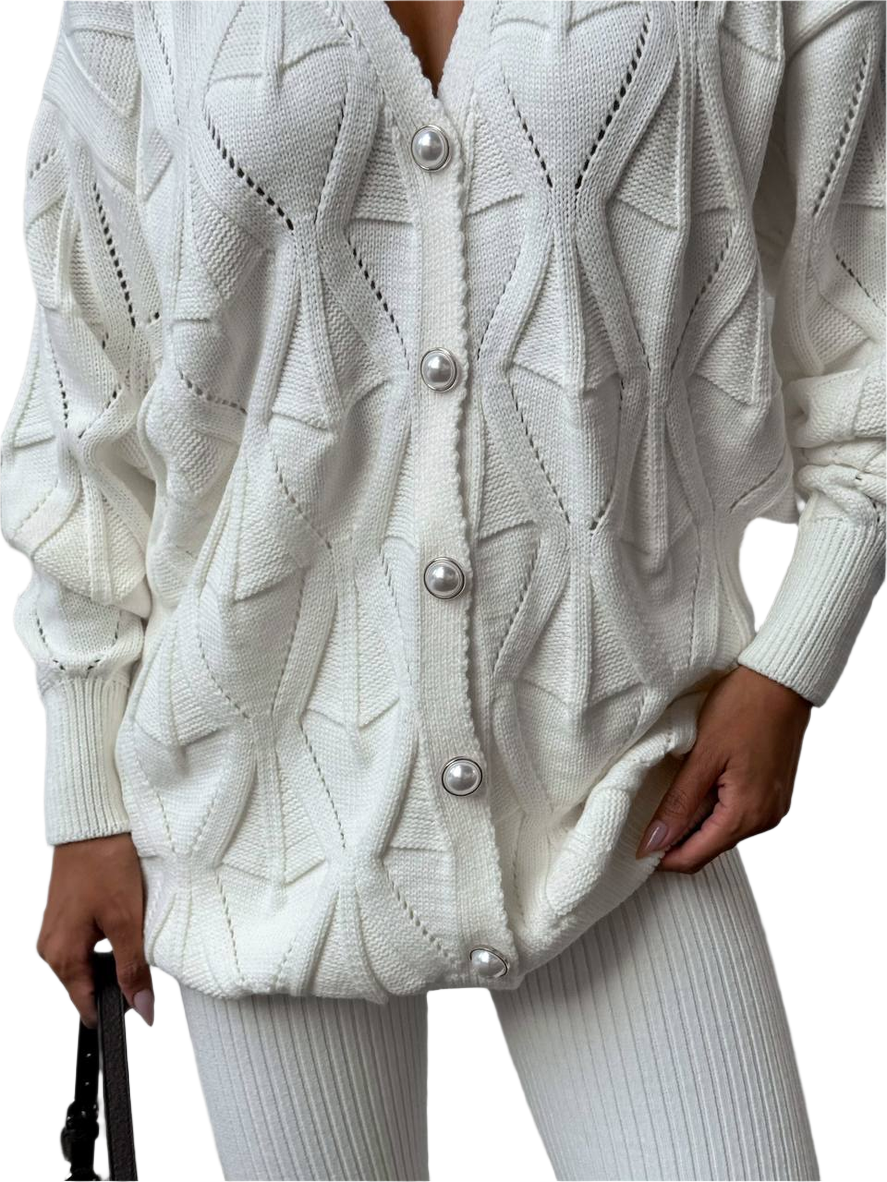 White knitted cardigan with pearl buttons on a white background