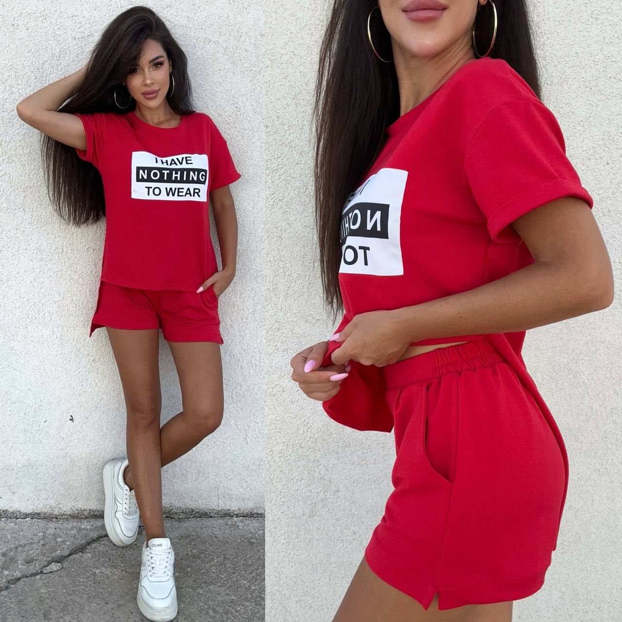 Woman wearing a red outfit with a graphic t-shirt and shorts, standing against a white wall.