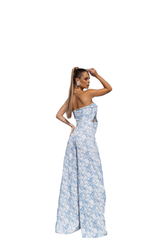 Woman wearing a blue floral strapless gown on a white background