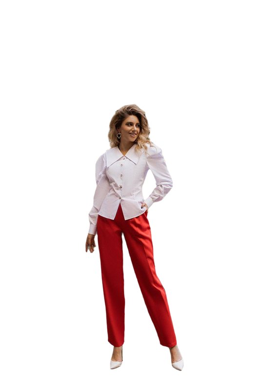 Woman wearing a white blazer and red pants on a white background