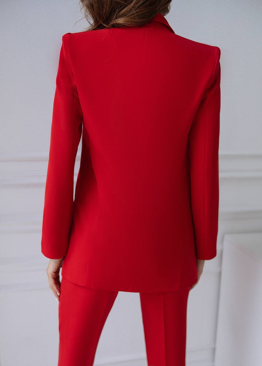 Red suit jacket and pants on a white background
