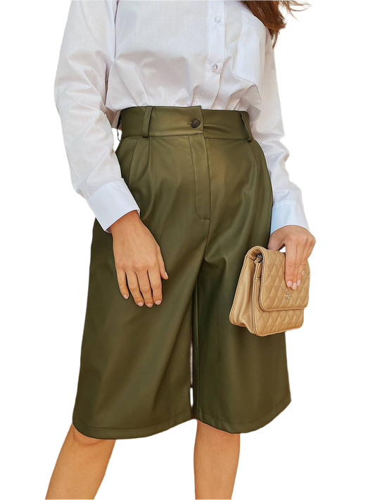 Person wearing olive green wide-leg pants and a white shirt, holding a beige handbag on a white background